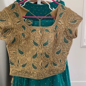 Teal green and gold stone work Lehenga